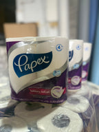 4 pack Papex toilet paper rolls on a table with a blurred background