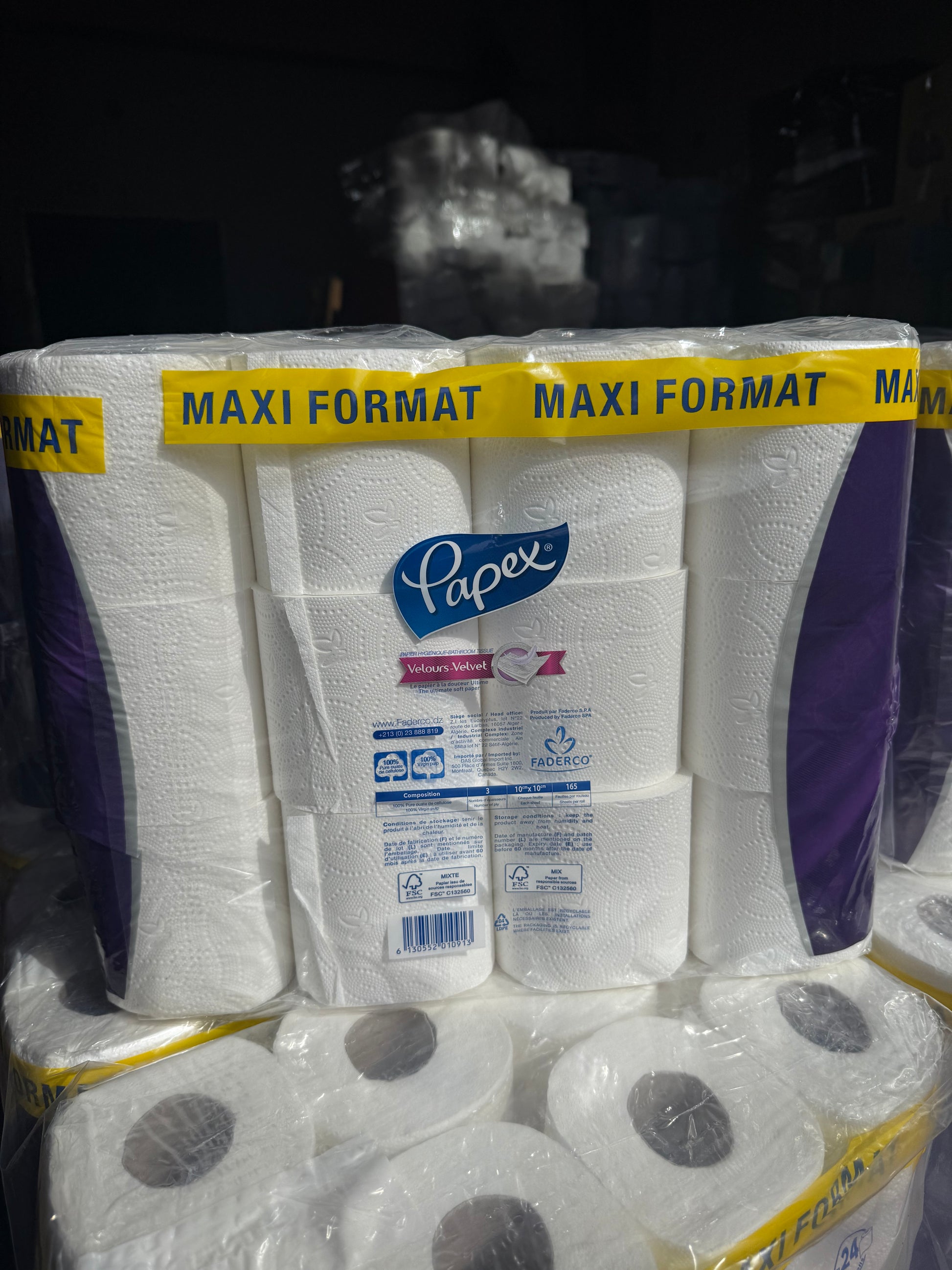 Packs of Papex toilet rolls with visible brand logos on a dark background