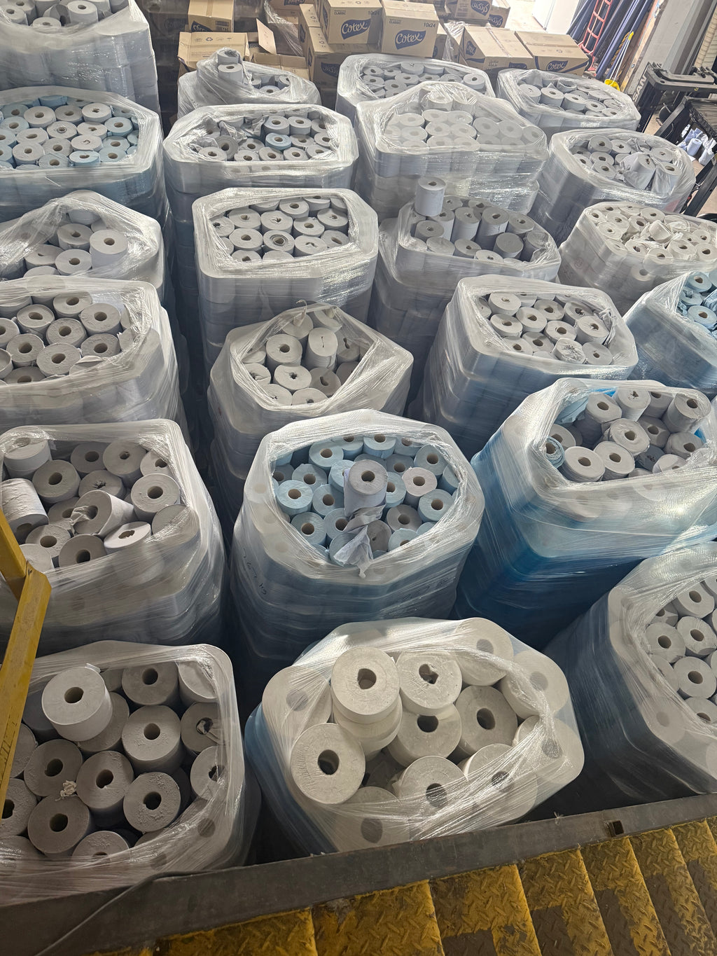 Pallets of blue centrefeed rolls 