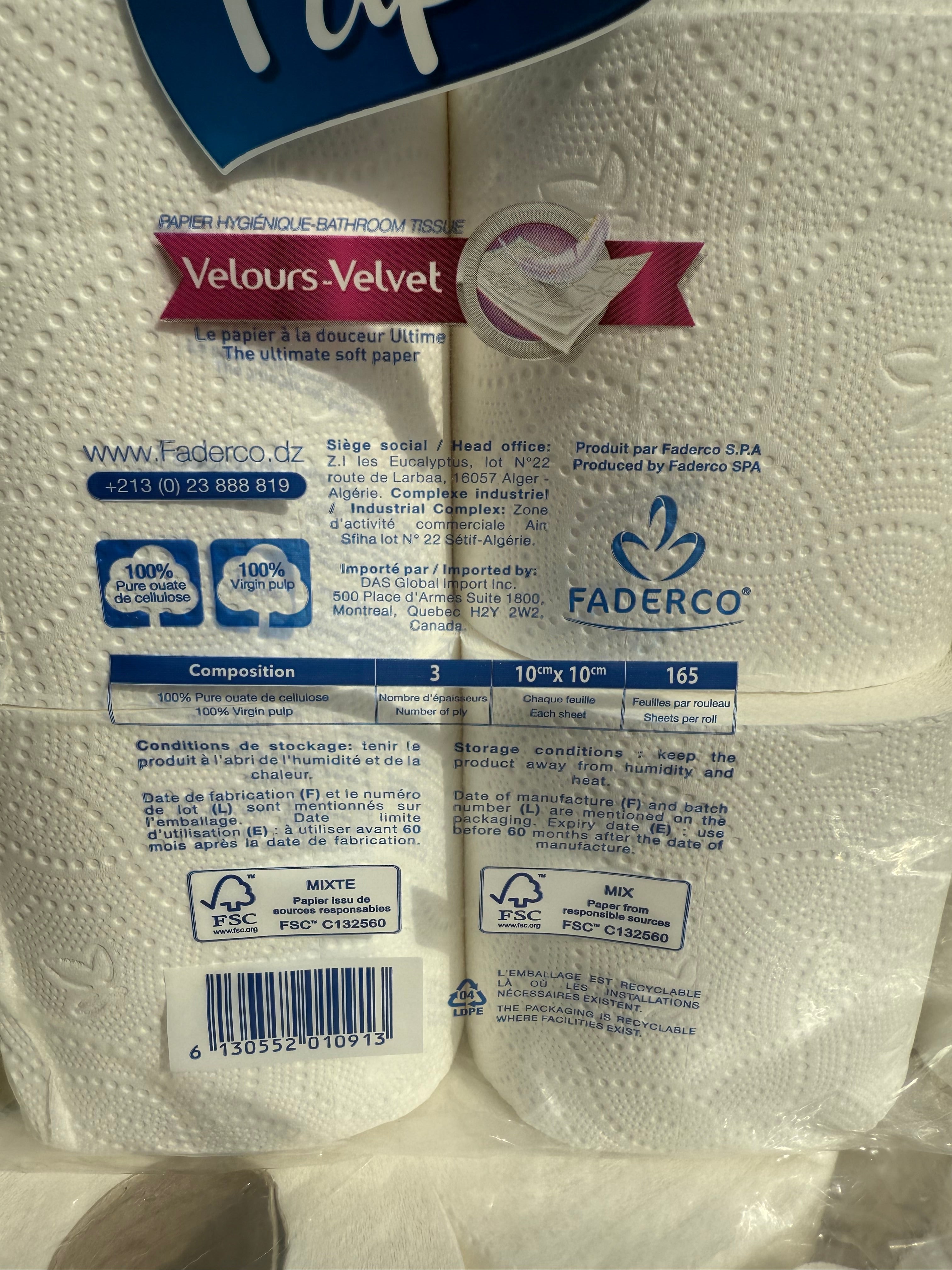 Packaged toilet paper with visible brand labels on a white background