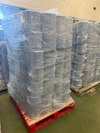 pallets of wrapped blue centrefeed rolls in a warehouse setting